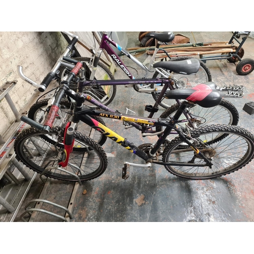 908 - Two mountain bikes, one Claud Butler Pagan with Shimano 21 speed gear system and one Giant 80X830 wi... 