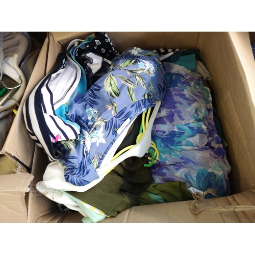 956 - Five boxes containing a large quantity of clothing, shoes and bed linen