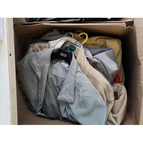 956 - Five boxes containing a large quantity of clothing, shoes and bed linen