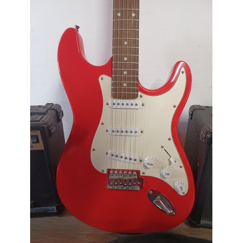 765 - Three items, one cased Elevation Stratocaster style electric guitar with tutorial book and two guita... 