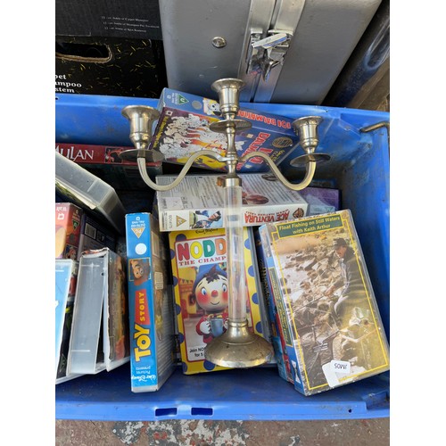 934 - A collection of house clearance items to include video tapes, candelabra, GS ST-4080 table saw, Kirb... 