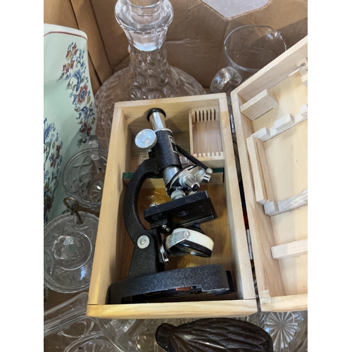 949 - Three boxes containing glassware, wooden cased Kibro microscope, silver plated salad servers, Typhoo... 