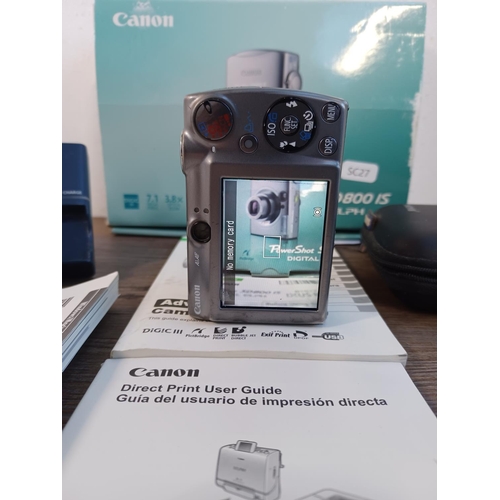 671A - A boxed and cased Canon PowerShot Digital ELPH SD800 IS 7.1mp digital camera with charger, instructi... 