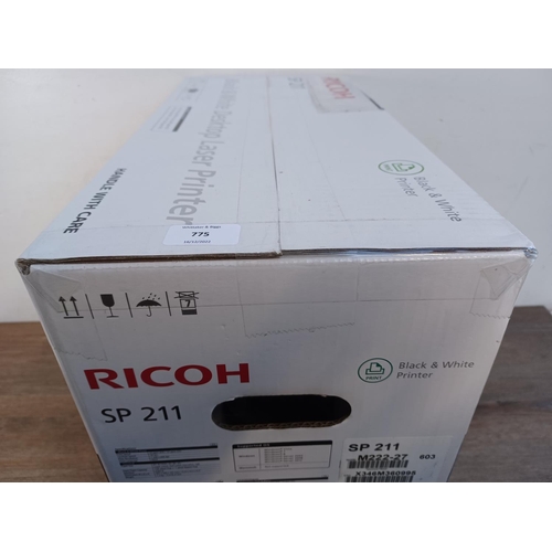 775 - A boxed, sealed and packaged Ricoh SP211 black and white desktop laser printer