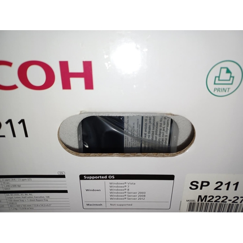 775 - A boxed, sealed and packaged Ricoh SP211 black and white desktop laser printer