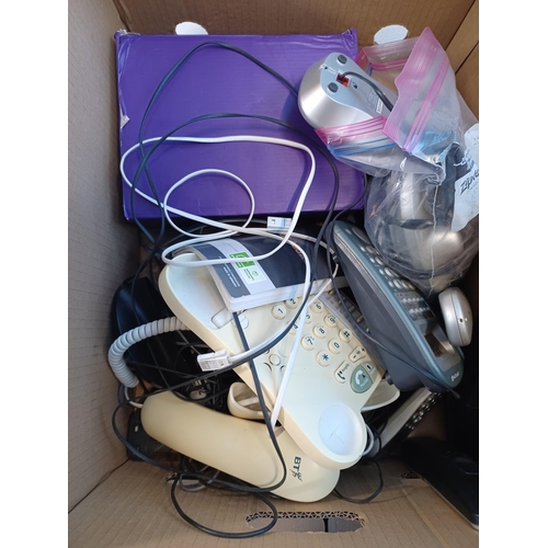 783 - A box containing a large quantity of landline phones