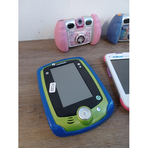 784 - Nine children's electronic items to include cameras, smart watches and tablets