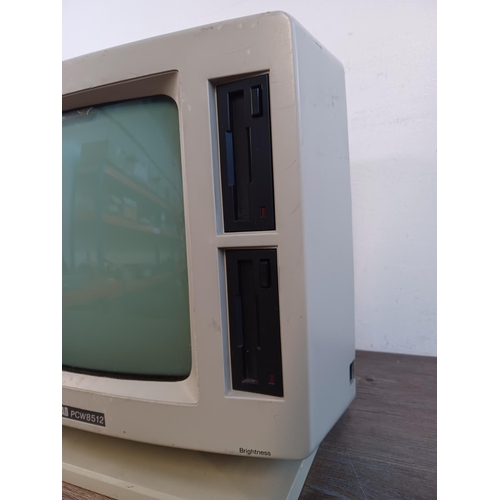 785 - A 1980s Amstrad PCW8512 personal computer/word-processor comprising one casing containing CPU, RAM a... 