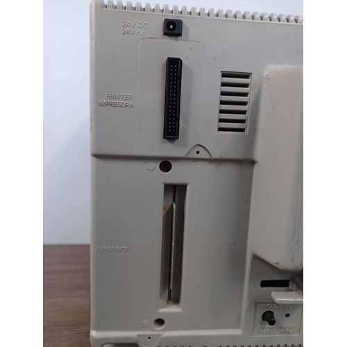 785 - A 1980s Amstrad PCW8512 personal computer/word-processor comprising one casing containing CPU, RAM a... 