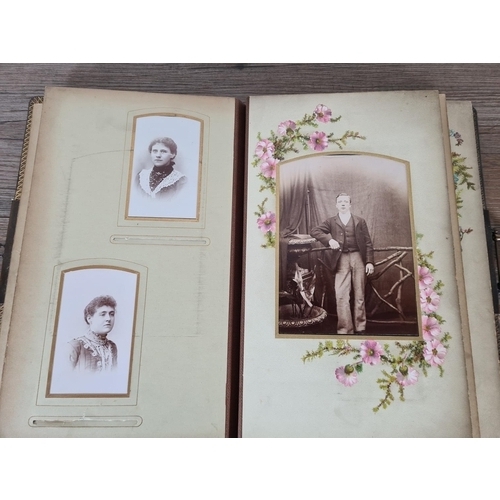 476 - A Victorian carte de visite album containing approx. thirty five cards