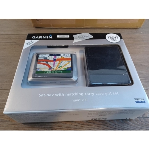 789 - A box containing a collection of satnavs to include boxed Garmin, TomTom, Mio etc.