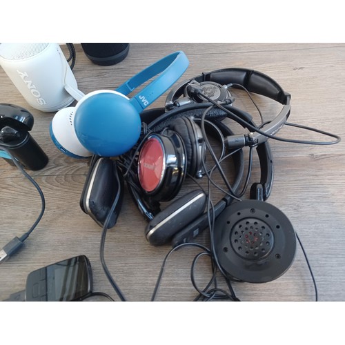 691 - A collection of MP3 players, headphones, personal cassette players and speakers, to include Sony, JV... 