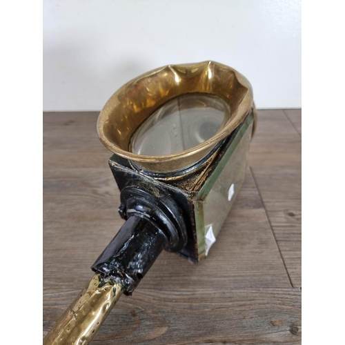 456 - An antique black metal and brass coach lantern - approx. 44cm high x 12cm wide x 18cm deep