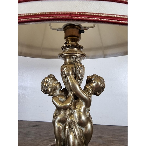 464 - A 19th century style brass cherub table lamp - approx. 32cm high