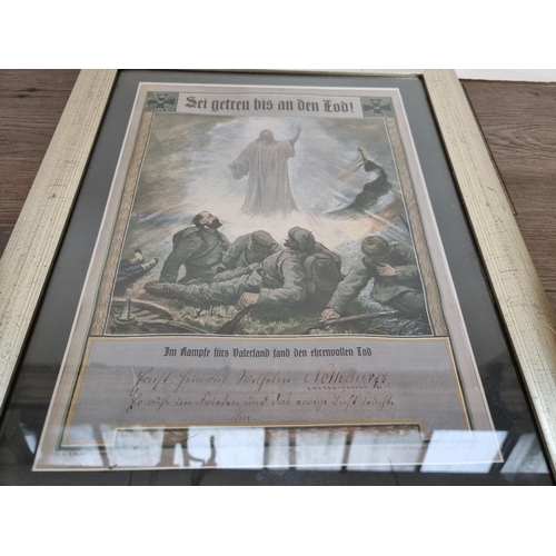 477 - A framed collection of four German WWI medals - approx. 62cm high x 39cm wide