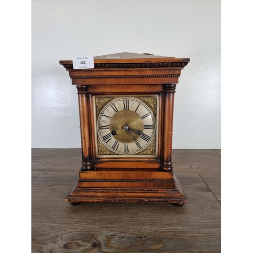 482 - An early 20th century German mahogany cased chiming mantel clock with brass face, key and pendulum -... 