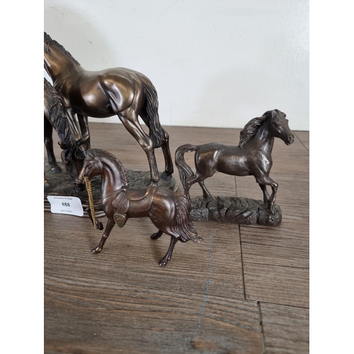 488 - Five bronze effect horse figurines - largest approx. 24cm high