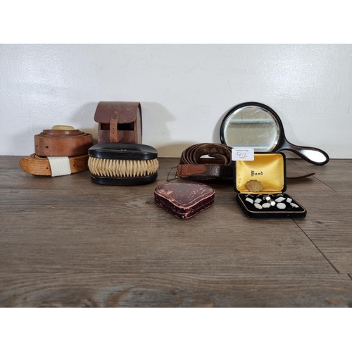 502 - A collection of vintage fashion and vanity items to include three leather belts, two ebony clothes b... 