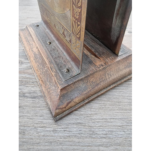 504 - An early 20th century brass and oak letter rack - approx. 15.5cm high x 17.5cm wide x 14cm deep