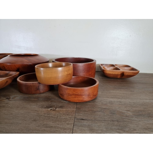 507 - Eleven carved wood bowls and dishes to include cedar and American cherry, lignum vitae, teak etc.