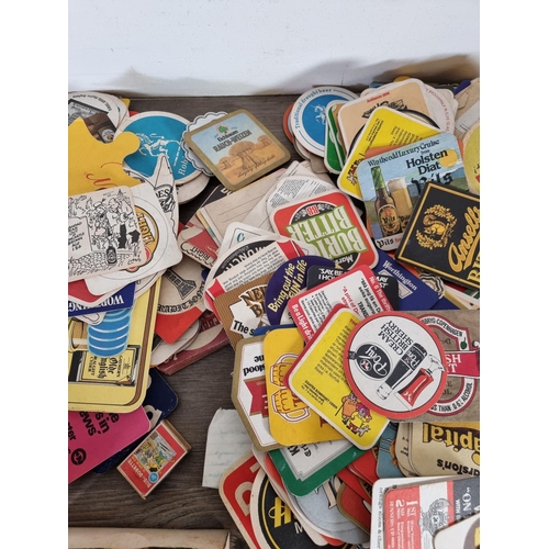 510 - A collection of vintage advertising beer mats