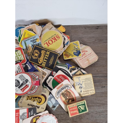 510 - A collection of vintage advertising beer mats