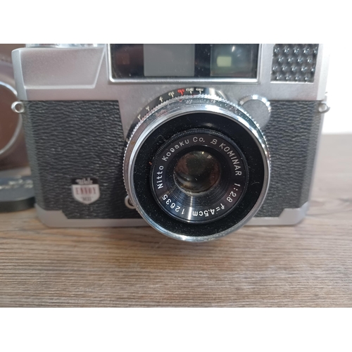 642 - A cased late 1950s Japanese Walz Envoy M-35 35mm rangefinder camera fitted with Kominar 1:2.8 f=45mm... 