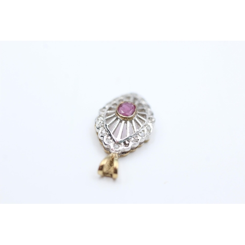 2005 - A 9ct gold ruby and diamond ornate openwork pendant - approx. gross weight 1.2 grams