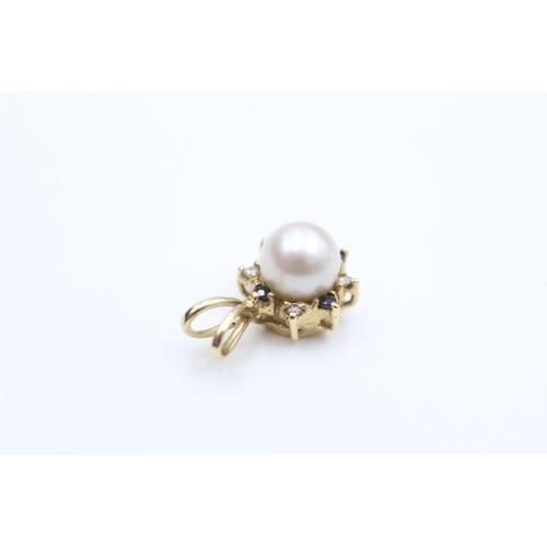 2007 - A 9ct gold pearl, sapphire and diamond cluster pendant - approx. gross weight 1.7 grams