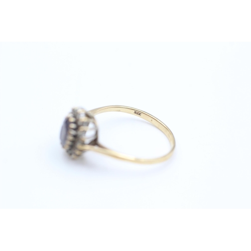 2013 - A 9ct gold sapphire and diamond halo dress ring, size O½ - approx. gross weight 1.7 grams