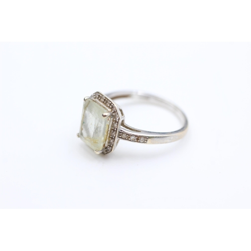 2014 - A 9ct white gold prasiolite and diamond halo dress ring, size L½ - approx. gross weight 2.6 grams