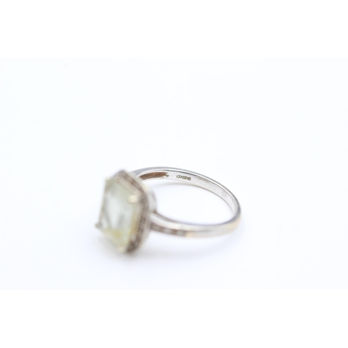 2014 - A 9ct white gold prasiolite and diamond halo dress ring, size L½ - approx. gross weight 2.6 grams