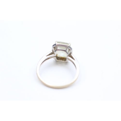 2014 - A 9ct white gold prasiolite and diamond halo dress ring, size L½ - approx. gross weight 2.6 grams