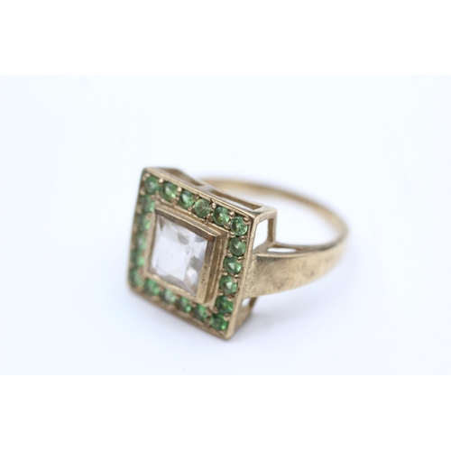 2016 - A 9ct gold clear and green gemstone dress ring, size S - approx. gross weight 5.5 grams