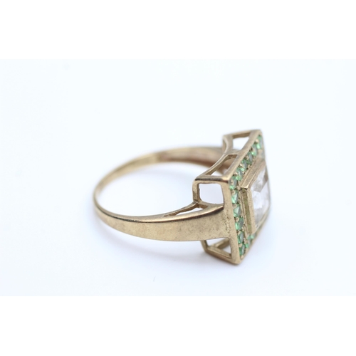 2016 - A 9ct gold clear and green gemstone dress ring, size S - approx. gross weight 5.5 grams