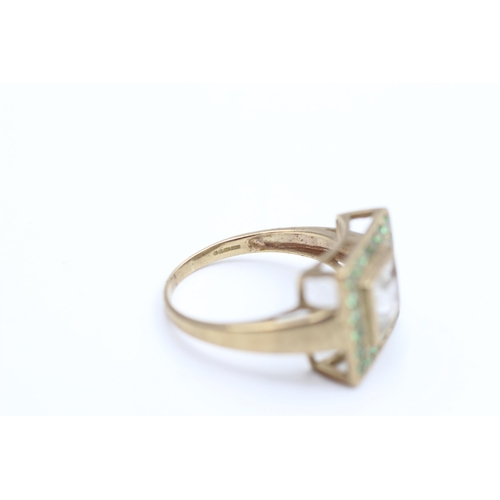 2016 - A 9ct gold clear and green gemstone dress ring, size S - approx. gross weight 5.5 grams