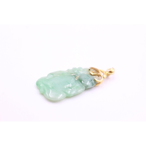 2017 - A 14ct gold and carved jade pendant - approx. gross weight 2.3 grams