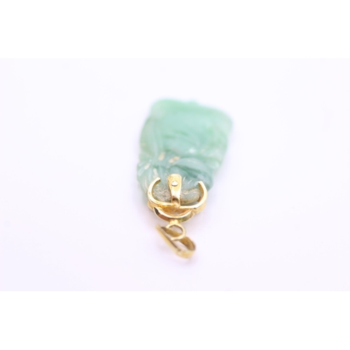 2017 - A 14ct gold and carved jade pendant - approx. gross weight 2.3 grams