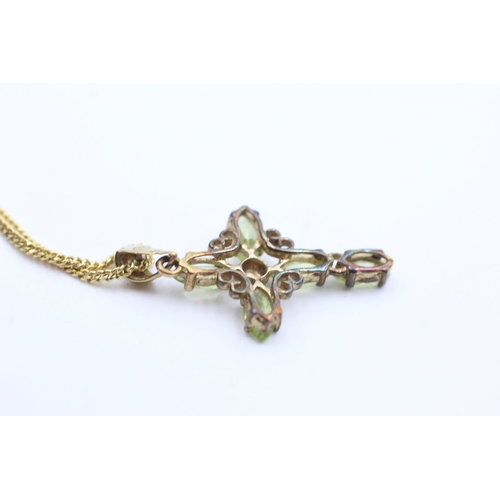 2025 - A 9ct gold peridot set cross pendant necklace - approx. gross weight 3.3 grams