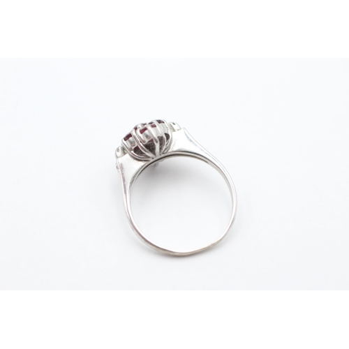 2033 - A 9ct white gold ruby and diamond cluster dress ring, size K ½ - approx. gross weight 2.9 grams