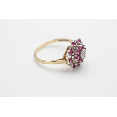 2034 - A 9ct gold ruby and diamond starburst cluster dress ring, size P - approx. gross weight 2.5 grams