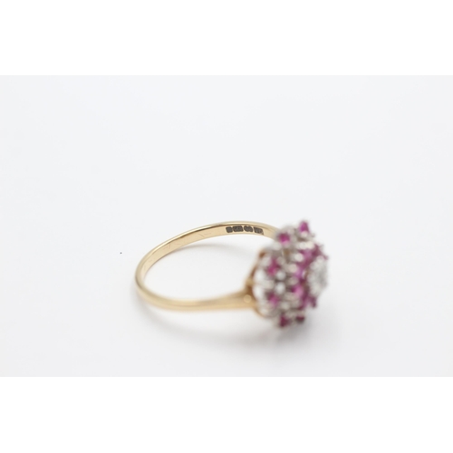 2034 - A 9ct gold ruby and diamond starburst cluster dress ring, size P - approx. gross weight 2.5 grams