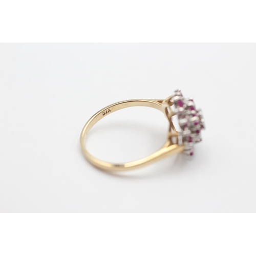 2034 - A 9ct gold ruby and diamond starburst cluster dress ring, size P - approx. gross weight 2.5 grams