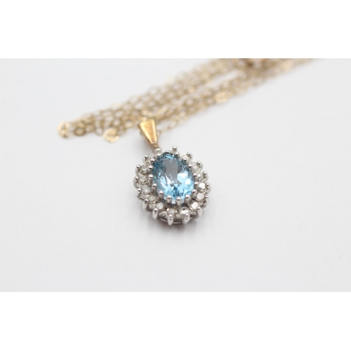 2036 - A 9ct gold blue topaz and diamond halo pendant necklace - approx. gross weight 1.7 grams