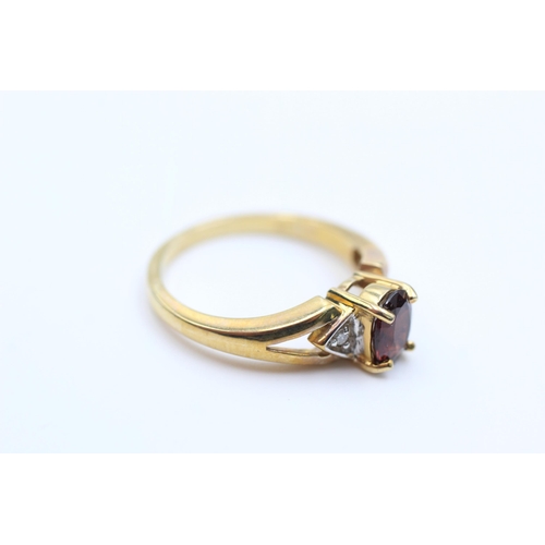 2041 - A 9ct gold diamond and garnet ring, N ½ - approx. gross weight 3 grams