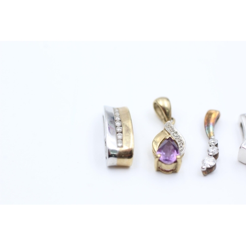 2051 - Four 9ct gold diamond set pendants to include synthethic ruby, amethyst etc. - approx. gross weight ... 