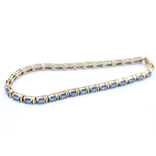 2055 - A 9ct gold sapphire tennis bracelet - approx. gross weight 10.3 grams