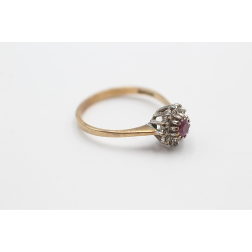 2057 - A 9ct gold ruby and diamond halo dress ring, size O - approx. gross weight 2.1 grams