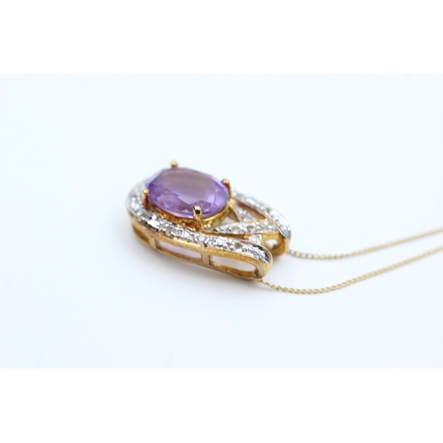 2063 - A 9ct gold amethyst and diamond pendant necklace - approx. gross weight 2.7 grams