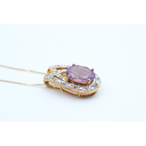 2063 - A 9ct gold amethyst and diamond pendant necklace - approx. gross weight 2.7 grams